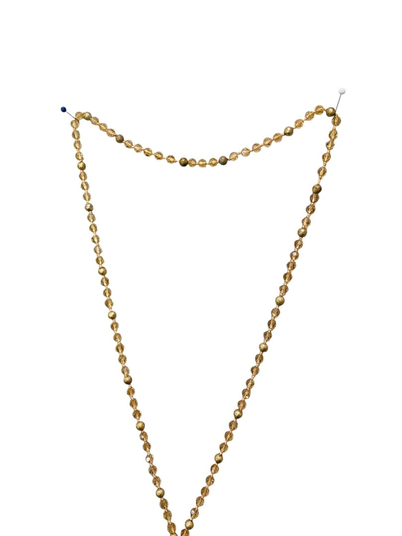 Goldtone and Beige Crystal Knot Necklace Tassel 40" Overhead