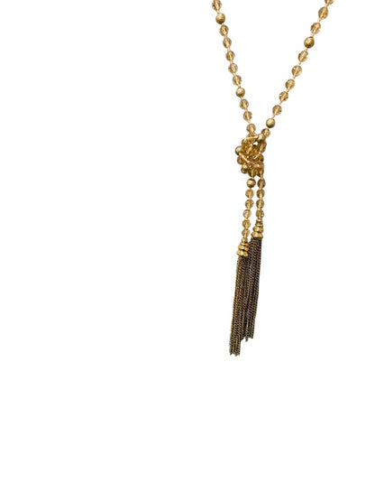 Goldtone and Beige Crystal Knot Necklace Tassel 40" Overhead