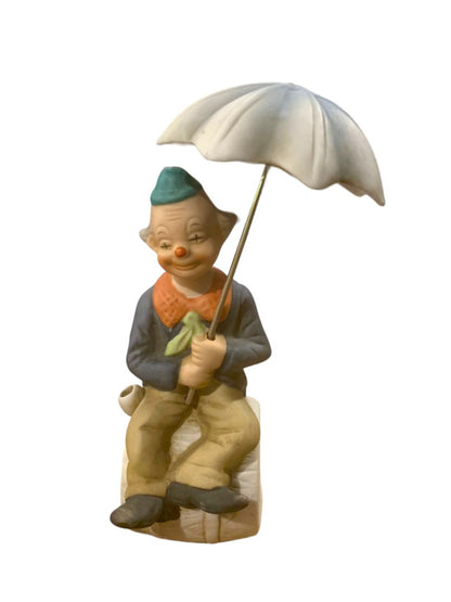 Vintage 1970s Clown Sitting on Barrel Holding Umbrella 8" Porcelain Figurine